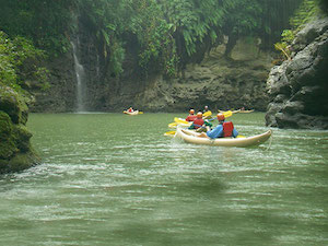 A group of people in canoes on the water.